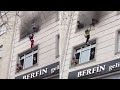 Mother throws children from burning building