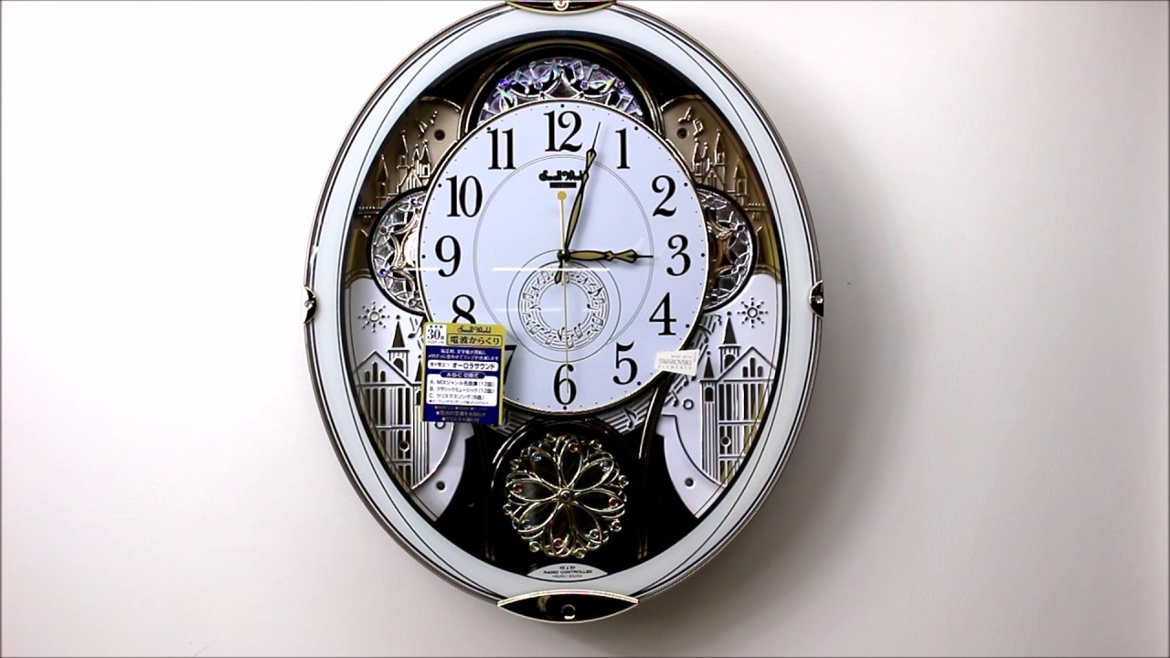 リズム時計製　電波掛時計 スモールワールドノエル 4MN509RH03　Melodies In Motion Wall Clock