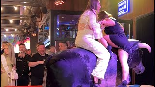 Two Girl In Black And White Dresess Riding On A Bull In Benidorm | Bull Riding 4K