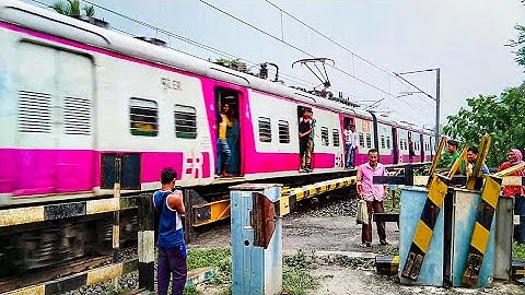 Newly Painted Shiny Colourful EMU Train furiously Crossing Railgate | Speedy Train at Level Crossing