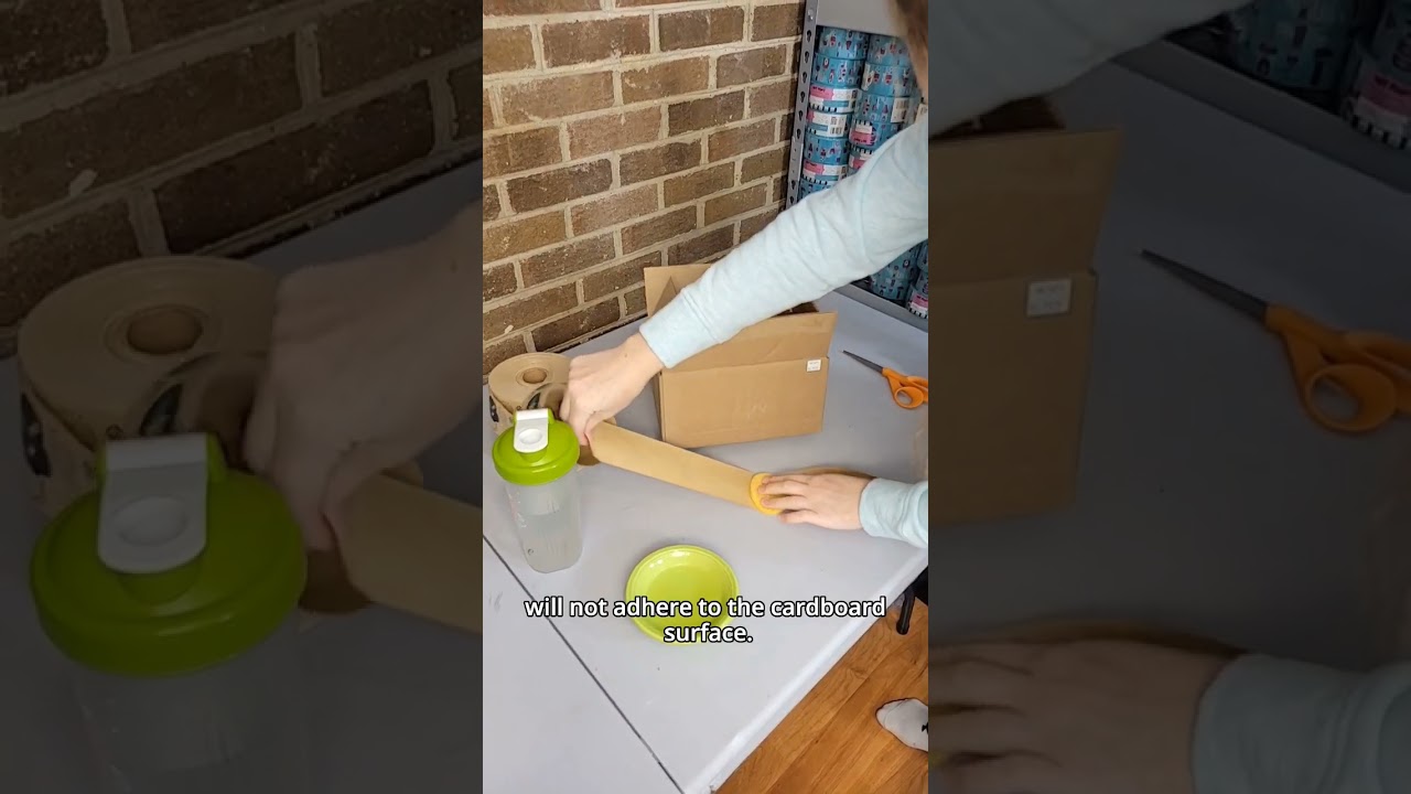 Taping a box with water-activated paper tape 