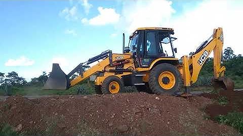 JCB Backhoe Machine Making Drain and Working For Dozer Pulling Tree Root JCB Moving on Place Khudai.