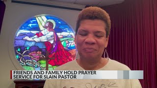 Friends and family hold prayer service for slain pastor