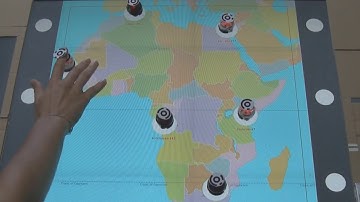 BotMap: Non-Visual Panning and Zooming with an Actuated Tabletop Tangible Interface