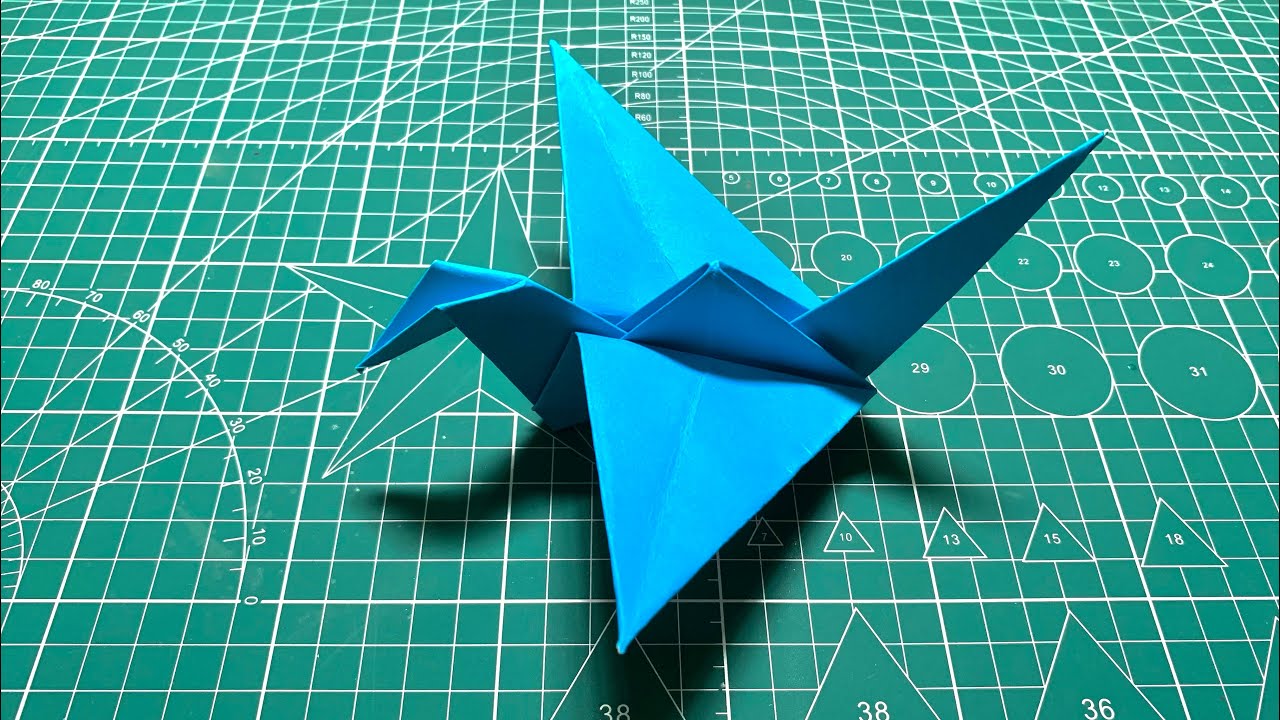 Fold a flapping bird out of colored paper | Paper Origami .