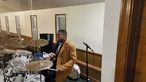 Minister Wallace Black Jr at rehearsal on the drums
