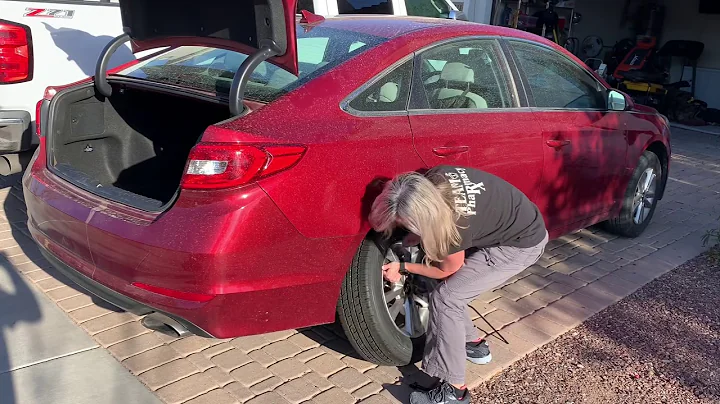 Rebecca demonstrates how to change a tire.