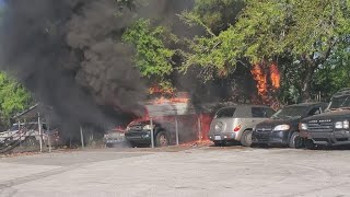 Car engulfed in flames at auto repair shop