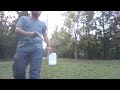 Knocking down a tower of cans by throwing disc golf frisbees