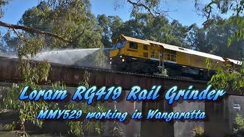 In Focus #01 - Loram Rail Grinder at work including bridge hose down.