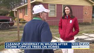 Wilson residents pick through downed trees, damaged roofs