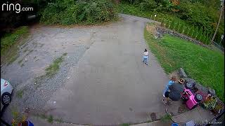 Girl rides pink Jeep Wrangler Power Wheel on driveway then flips backwards on head (Security camera)