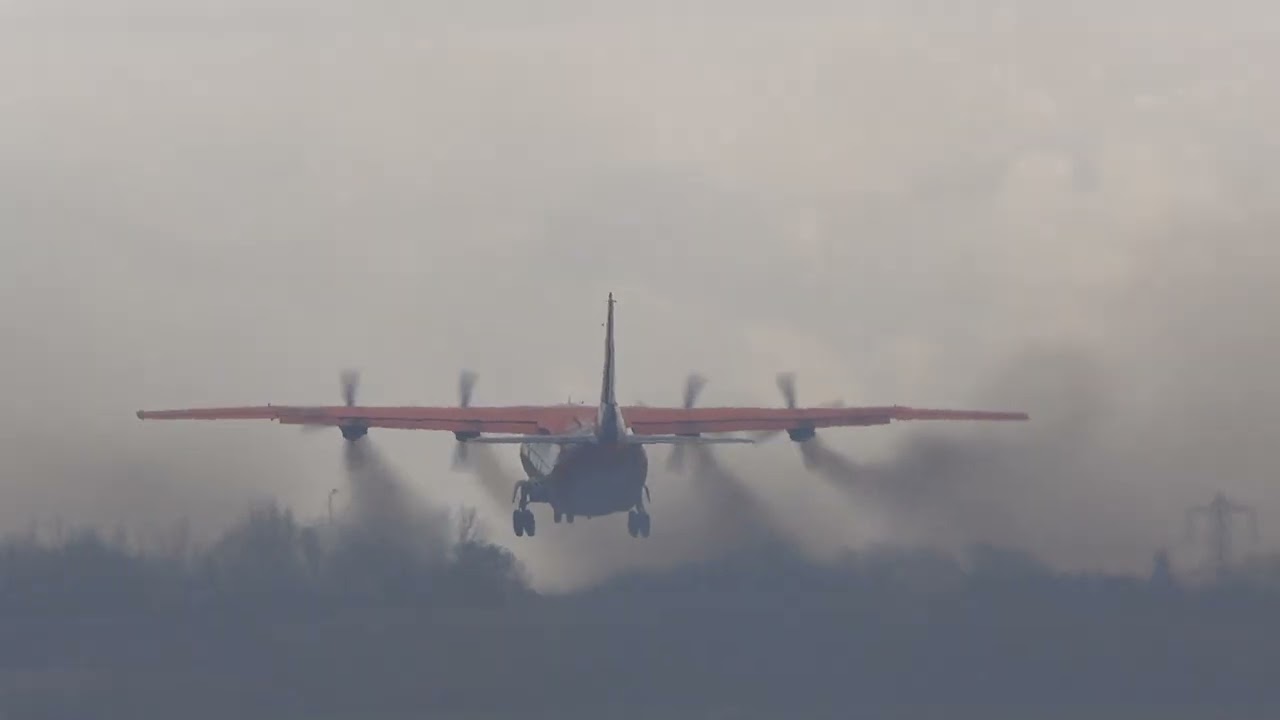 CAVOK Antonov AN12 departs from Birmingham with trademark Smoke Trail.