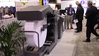 Tecnau Roll Feeder running on a RISO T2