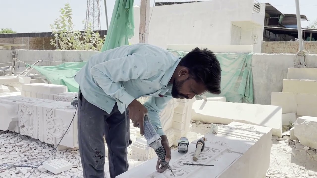 Artisan Carving Stone Pillar with Pneumatic Chisel