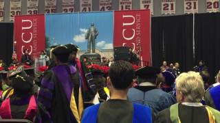 Fall 2016 graduate program completers walk across the stage