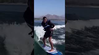 I went surfing with my hands cuffed behind my back! 🏄🏾‍♂️🚔#wakesurf #shorts