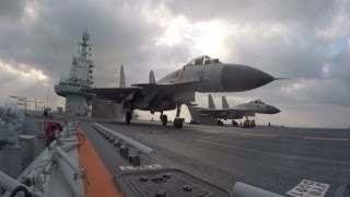 China's Aircraft Carrier Liaoning and Its Fleet Return to Qingdao Port