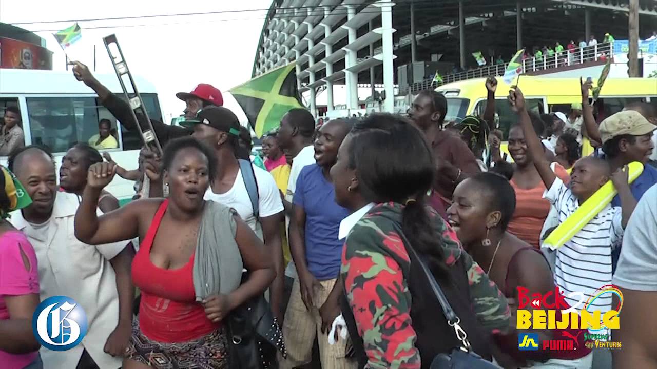 BEIJING BLURB: Jamaicans celebrate 4x100m in Half Way Tree