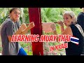 Teens learning muay thai in krabi thailand
