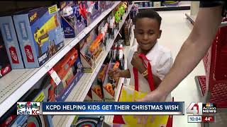 Kansas City police team up with children for biggest Shop with a Cop event