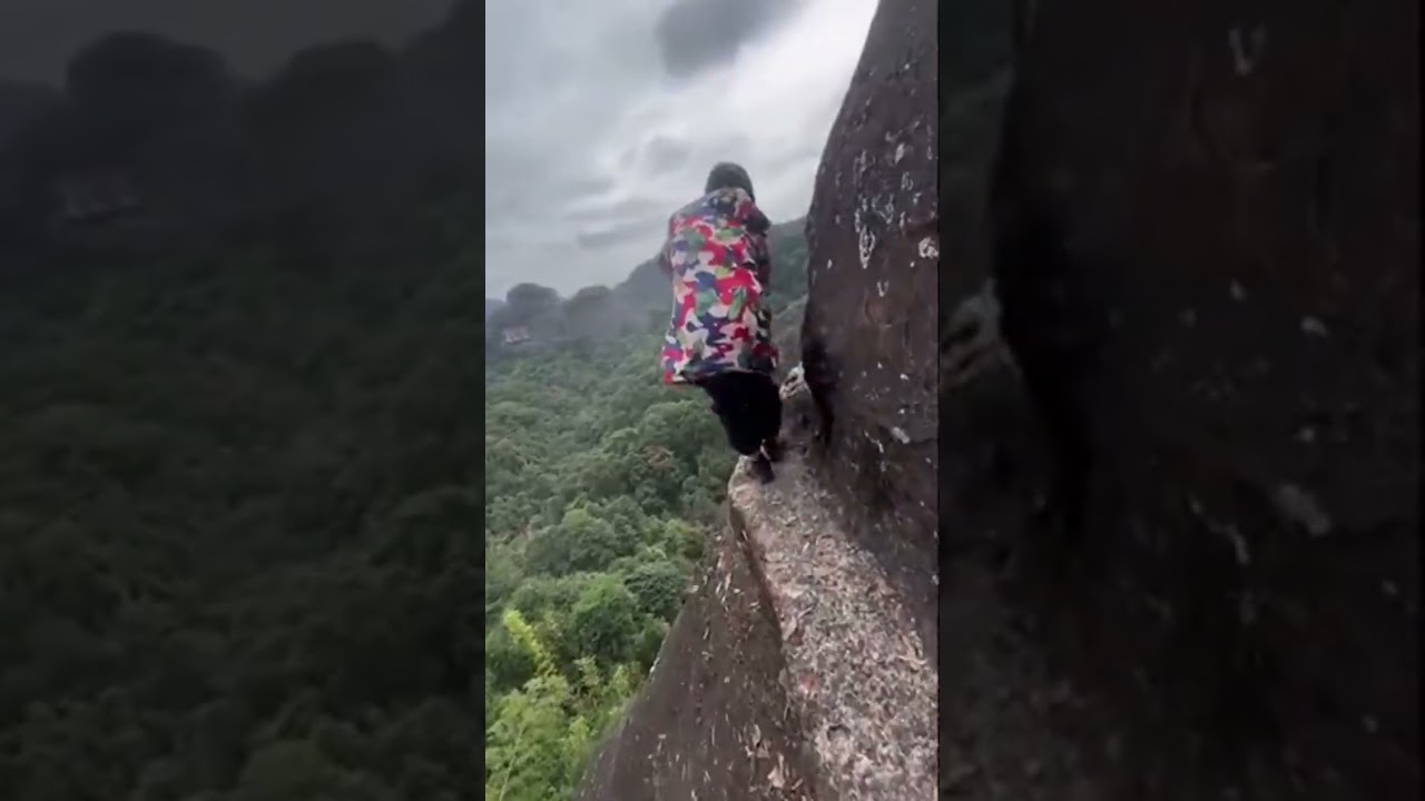 No Safety Gear?! Woman Sweeps on Tiny Mountain Ledge with Deadly Drop-Off