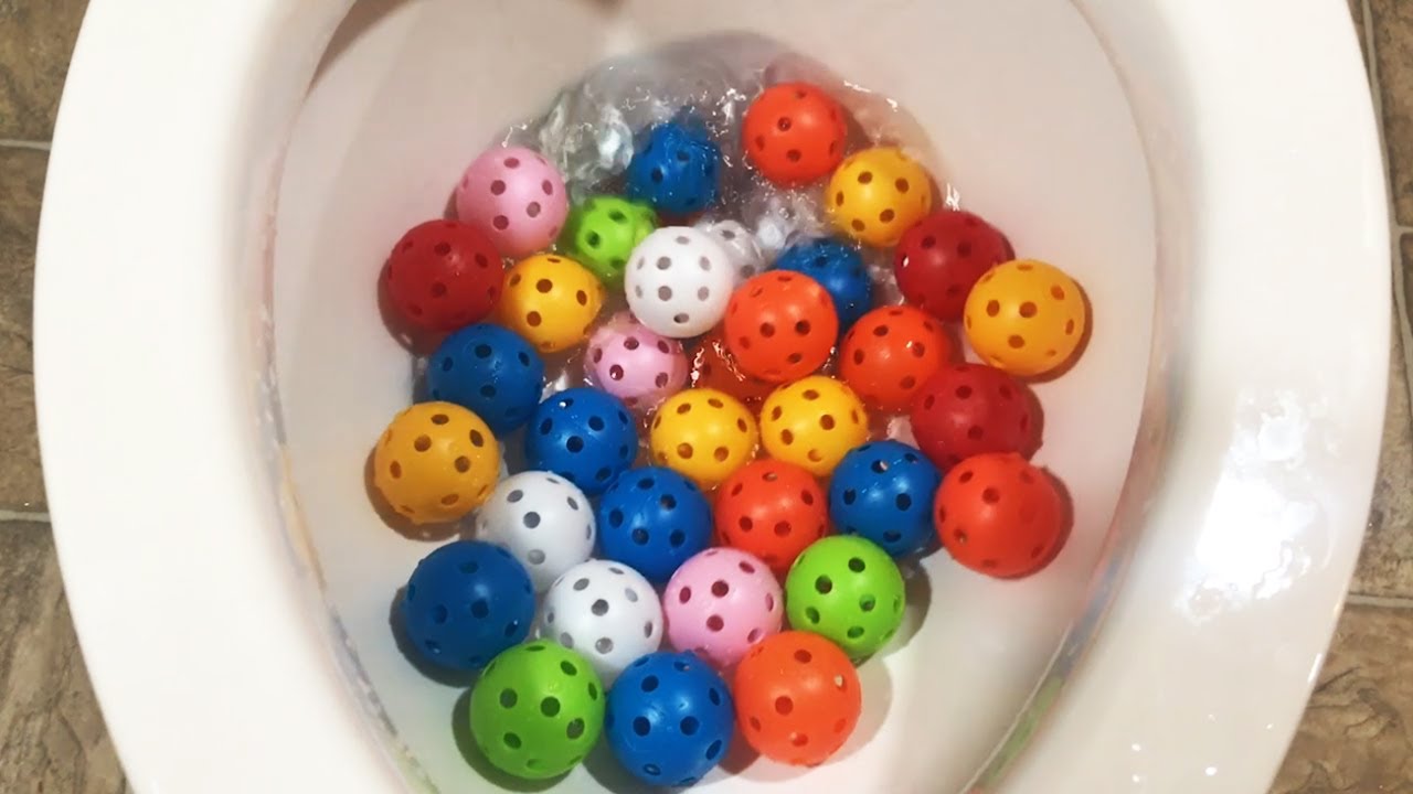 Trying to flush 40 Rainbow Plastic Balls down the World's Strongest