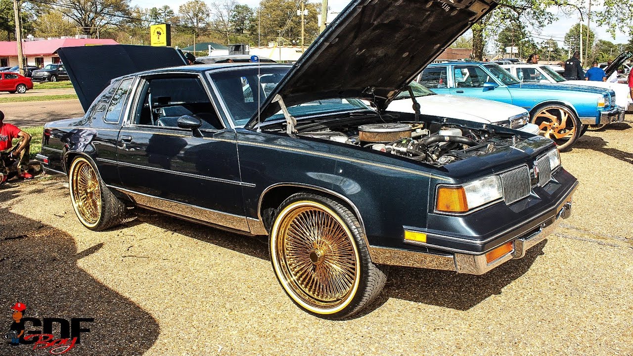 Oldsmobile Cutlass on All Gold Spokes and Vogues.