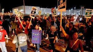 GM cuts health care on strikers