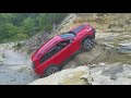 Stock jeep cherokee trailhawk climbs waterfall