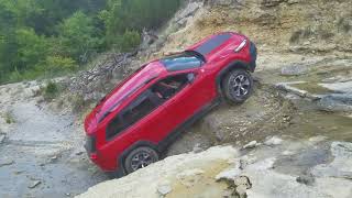 : Stock Jeep Cherokee Trailhawk climbs waterfall