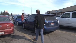 A gift card surprise for people outside a Goodwill thrift store