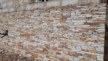 BUILDING IN GHANA. INSTALLATION OF NATURAL STONE CLADDING IN ADENTA ACCRA