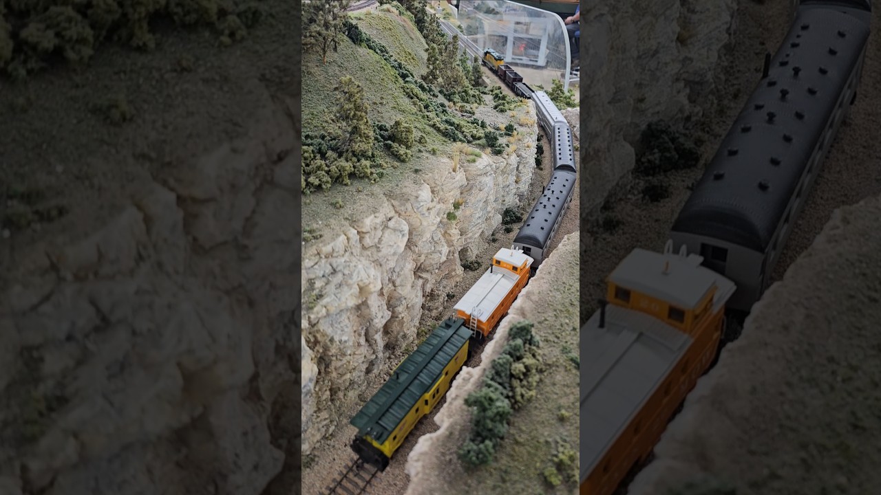 The CNW maintenance of way train enters the mountainside mainline. 