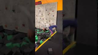 Girl attempts backflip into foam pit then lands on her head in scorpion position