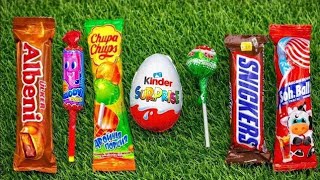 Popular Candys / some lots of colorful rainbow lollipop candy / unpacking chocolate eat