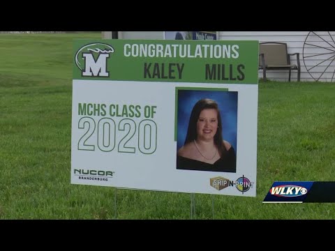Meade County staff delivers personalized yard signs to Class of 2020