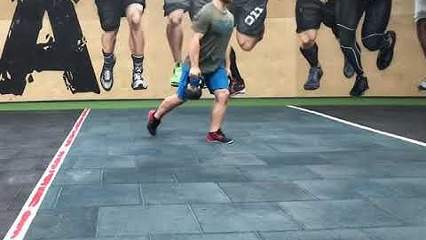 Alternating reverse lunges with farmers carry