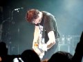 Living End live - Chris Cheney guitar solo with VB bottle