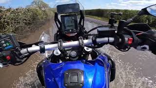 Motorcyclist Unhappy with Car Driver's Splashy Maneuver in the Rain