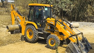 JCB Backhoe Lifting Heavy Culvert Pipe and Installing in Drain - JCB Machine Working