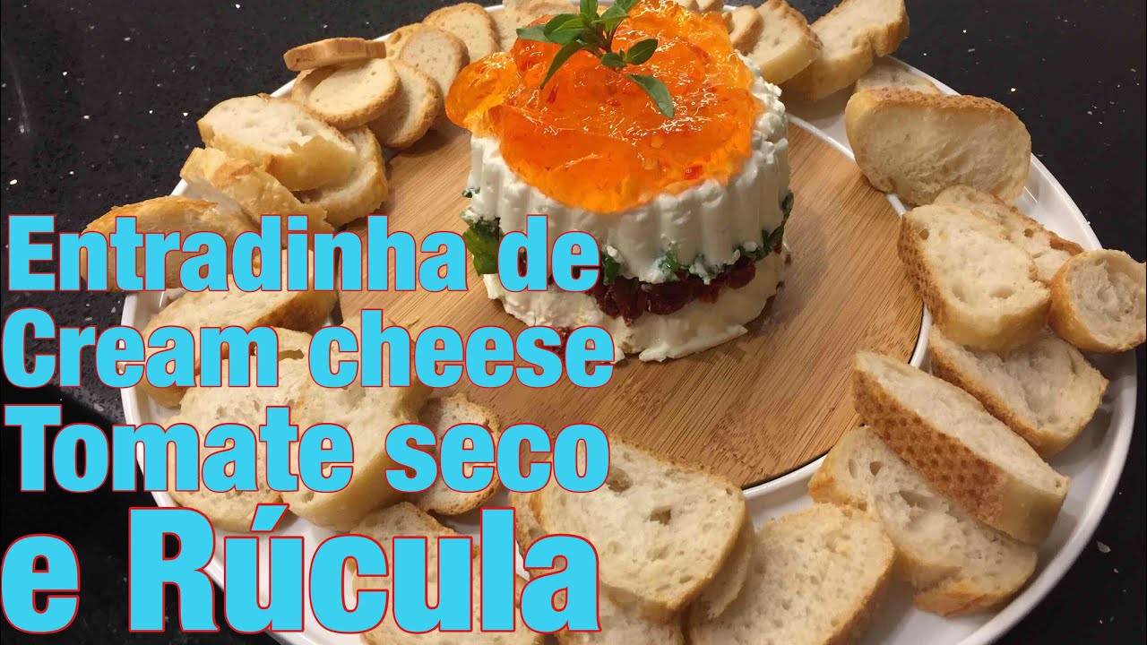 Entradinha de cream cheese com tomate seco e rúcula