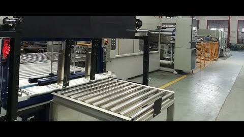 An Inline folding gluing and strapping machine for corrugated carton high speed making process.