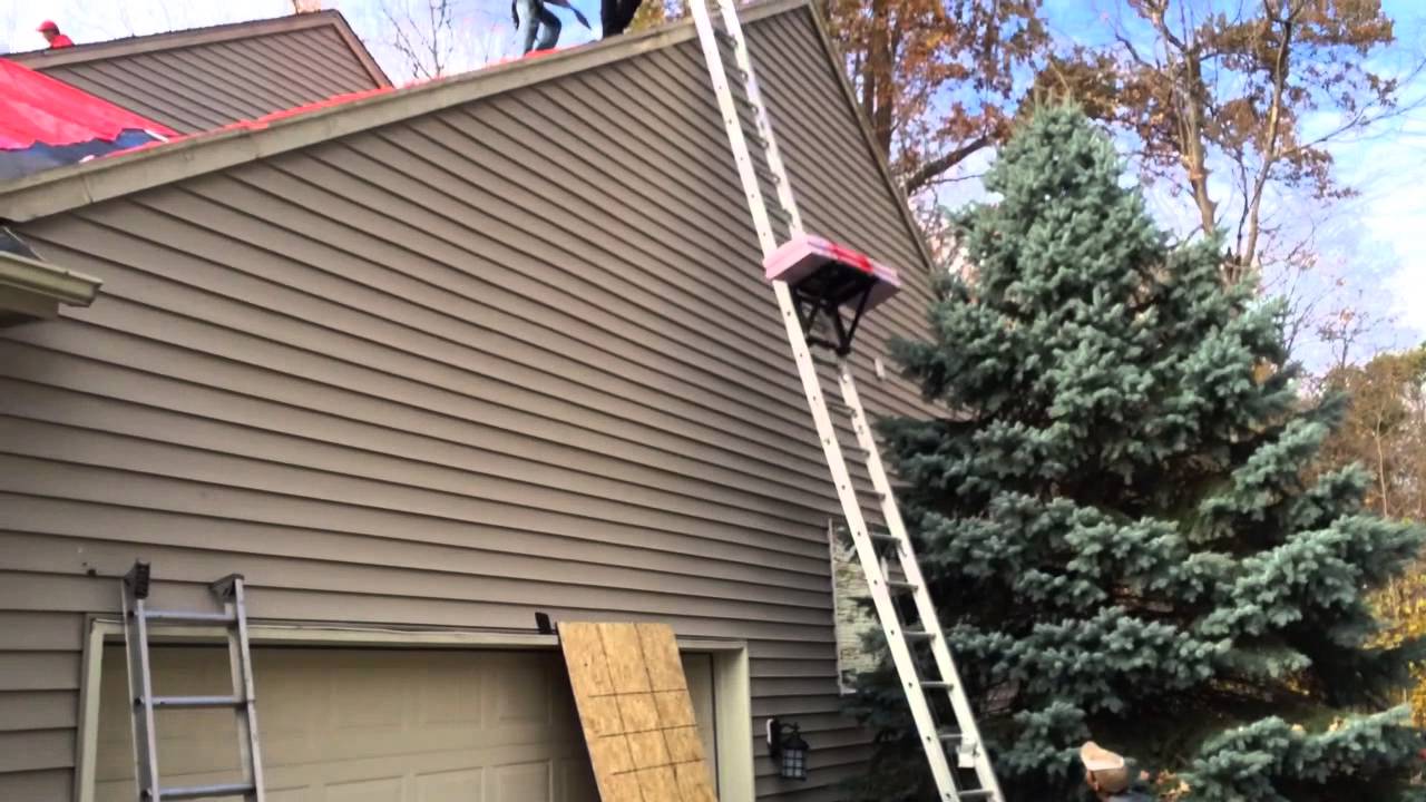 How roofers raise shingles to a roof YouTube