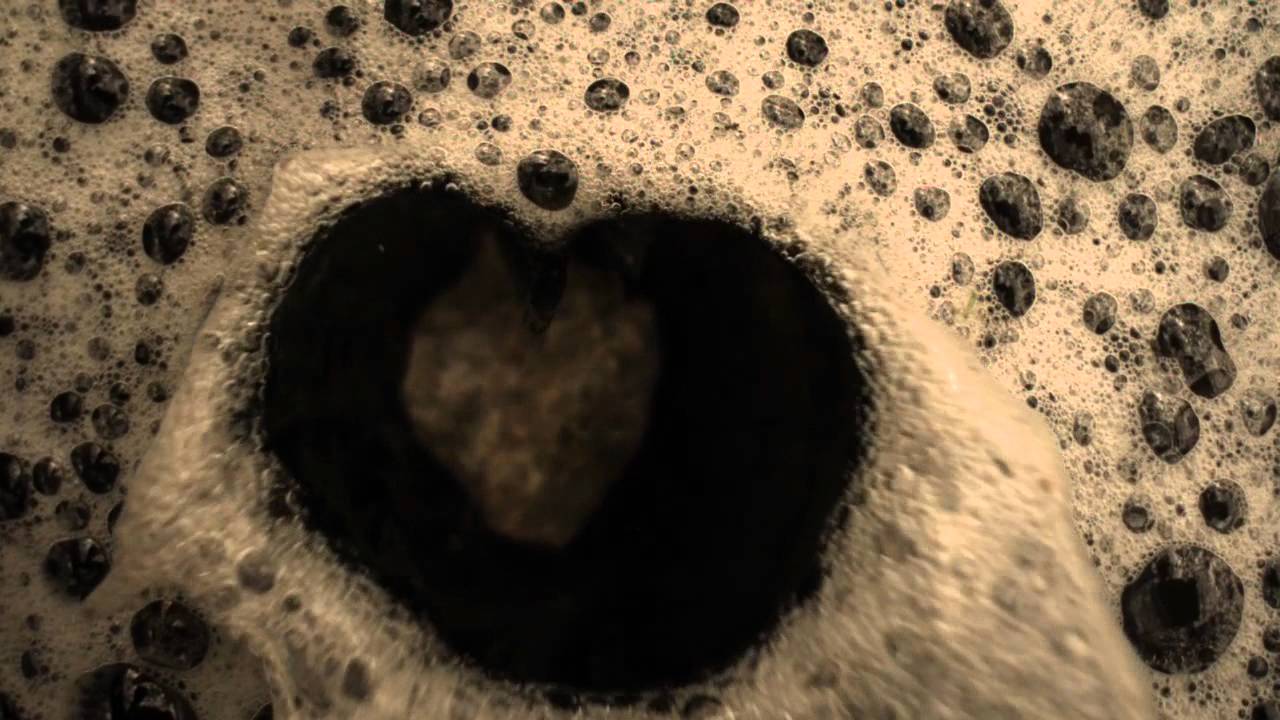 Rock falling into water with bubbles in slow motion - YouTube