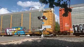 Northbound Union Pacific mix freight train at Houston street in Buda  Texas on 5/29/24