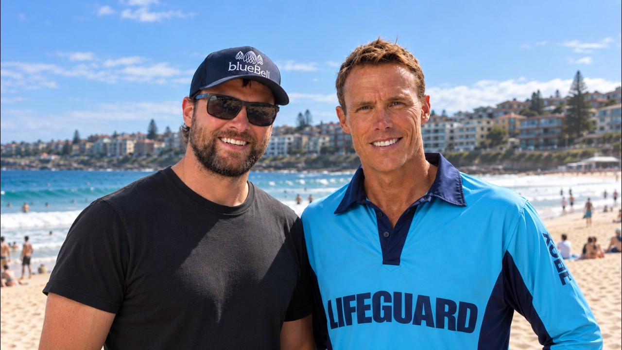 What happens when someone who has spent his life rescuing people faces something he cannot rescue his own mum from?

In this episode, Andrew Karesa sits down with Andrew “Reidy” Reid, longtime Bondi Rescue lifeguard, endurance athlete and dementia advocate, for an incredibly open conversation about lifeguarding, family, caregiving, grief, endurance sport, and his mum Trish’s journey with dementia.

Reidy has spent more than 20 years as a lifeguard, becoming one of the familiar faces of Bondi Rescue. He has also completed more than 50 marathons, competed in Ironman triathlons, and even holds a Guinness World Record for running a marathon carrying a surfboard.

But years before dementia became part of his own family, Reidy had already started using that endurance background to support dementia research through the 155-kilometre Bondi2Berry ride.

Then his mum, Trish, was diagnosed with Alzheimer’s disease and vascular dementia.

Reidy speaks candidly about watching his relationship with his mum change, stepping into a caregiving role, navigating difficult family dynamics, and eventually seeing his mum move into a nursing home. He describes the complicated grief of mourning someone who is still alive and the difficulty of leaving after a visit when his mum asks why she cannot come home with him.

He also reflects on the things dementia has not taken away. Trish still remembers the words to the Elvis songs she played for her children growing up, and Reidy shares how music, old memories, family videos, puzzles and time with his children can still create moments of connection.

The conversation also explores Reidy’s life beyond dementia, from growing up around Bondi and becoming a lifeguard to the beginnings of Bondi Rescue, extraordinary rescues, more than 50 marathons, Ironman racing, his 2:49 marathon, and the unlikely story behind his Guinness World Record marathon carrying a surfboard.

In this episode:

* Growing up around Bondi and how Reidy became a lifeguard
* The real-life rescues behind Bondi Rescue
* What more than 20 years of lifeguarding has taught him about patience and caregiving
* Why Reidy started supporting dementia research before his mum was diagnosed
* Trish’s early signs of dementia and eventual diagnosis
* What it feels like to mourn someone who is still alive
* The emotional difficulty of visiting a parent living in a nursing home
* Navigating caregiving and complicated family relationships
* Why music can still bring moments of connection with his mum
* The memories of Trish that Reidy never wants to lose
* Why running has become one of his most important coping mechanisms
* More than 50 marathons, Ironman and breaking three hours in the marathon
* The wild story behind running a 3:17 marathon carrying a surfboard
* Bondi2Berry and raising money for dementia research
* What Reidy wants other families navigating dementia and grief to know

This is a conversation about much more than Bondi Rescue. It is about what happens when the person accustomed to being the rescuer becomes a son trying to navigate something he cannot fix.

And through all of it, Reidy offers a simple message to other families living through dementia: be kind to yourself. You are navigating grief and doing the best you can.

———

Join The Village and help shape conversations like this by submitting questions to our guests: https://www.patreon.com/cw/blueBellVillage

———

00:00 Introduction to Andrew "Reidy" Reid
02:35 Lessons learned from lifeguarding: Patience and calmness
03:55 Reconnecting with people saved at Bondi Beach
05:33 A memorable rescue and reflection on mistakes
09:38 Bondi2Berry
17:19 Life growing up
19:12 Becoming a Bondi lifeguard
21:09 Andrew’s personal struggles and resilience
25:36 Andrew’s childhood, early life, and career path
26:37 Experiences with his mother’s dementia and caregiving challenges
35:39 Bringing children to visit the nursing home
39:43 Taking mum out for quality time
41:46 The importance of documenting family stories
50:40 First signs of dementia
01:00:56 Reflections on life, loss, and hope
01:05:32 World record race
01:12:43 IRONMAN Triathlons
01:22:47 Lightning Round
01:36:35 Bondi terrorist attack

———

This episode is brought to you by Eugeria. Check out their website for dementia products you can trust.

———

Disclaimer: This podcast is for general information only, not medical advice. Consult a qualified healthcare provider about your health. In an emergency, contact local emergency services. Guests’ views are their own and do not necessarily reflect those of Andrew Karesa or blueBell Village Ltd. Third-party references are for information only, not endorsements. You use this podcast at your own risk. Andrew Karesa, blueBell Village Ltd., and their team are not liable for any loss, injury, or damage arising from its use.