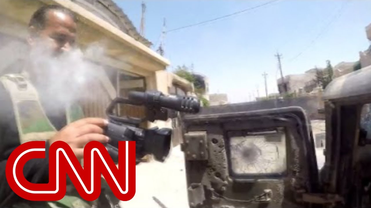 Cameraman narrowly survives sniper shot