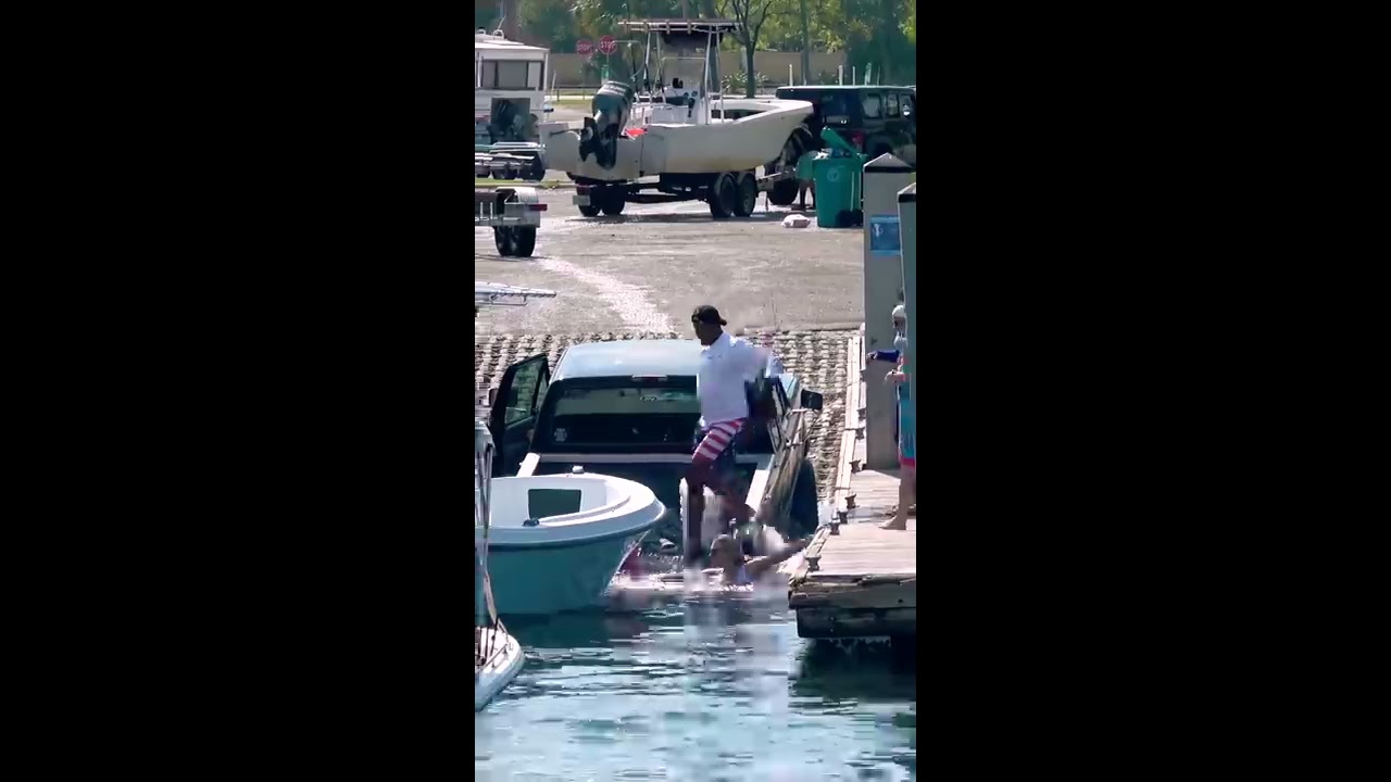 LADY JUMPS IN BOAT SINKING THEIR TRUCK Shorts