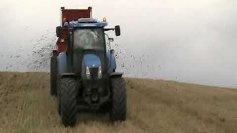 NC 11m3 Manure Spreader with New Holland comming over the hill.mpg
